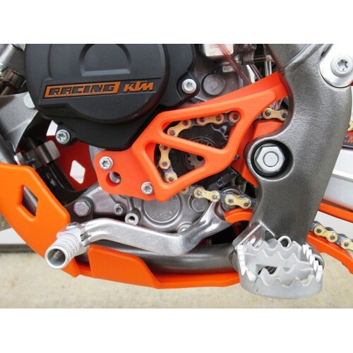 TM Designworks  Integrated Case Saver / Sprocket Cover / Frame Pad  KTM 65  (09-C).   Husqvarna 65 TC  (17-C).   Gas Gas 65 MC  (21-C).   Orange